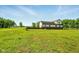 Lush backyard features privacy and serenity for entertaining or enjoying nature at 4450 W 300 N, Fairland, IN 46126