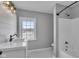 Modern bathroom with white vanity, shower, and bathtub at 4450 W 300 N, Fairland, IN 46126