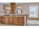 Elegant bathroom with double vanity, large mirrors, and a jetted tub at 4450 W 300 N, Fairland, IN 46126