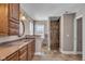 Bathroom with walk-in shower, wood vanity, and window at 4450 W 300 N, Fairland, IN 46126