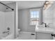 Modern bathroom with shower, bathtub, and updated vanity at 4450 W 300 N, Fairland, IN 46126