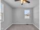 Spacious bedroom with grey walls, carpet, and a ceiling fan at 4450 W 300 N, Fairland, IN 46126