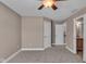 Bedroom with carpet, ceiling fan, and access to bathroom at 4450 W 300 N, Fairland, IN 46126