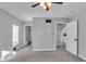 Well-lit bedroom with grey walls, carpet flooring, and a walk-in closet at 4450 W 300 N, Fairland, IN 46126
