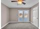 Bedroom with carpet, double doors leading to deck, and ceiling fan at 4450 W 300 N, Fairland, IN 46126