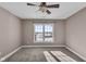 Bedroom with carpet, large window, and ceiling fan at 4450 W 300 N, Fairland, IN 46126