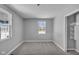 Bright bedroom with grey walls, carpet flooring, and built-in shelving at 4450 W 300 N, Fairland, IN 46126