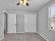 Simple bedroom with grey walls, carpet flooring, and double closets at 4450 W 300 N, Fairland, IN 46126