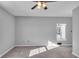Sunny bedroom with grey walls, carpet, and a unique window seat at 4450 W 300 N, Fairland, IN 46126