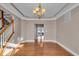 Formal dining room with hardwood floors and view into kitchen at 4450 W 300 N, Fairland, IN 46126