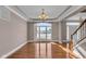 Bright dining room with hardwood floors, chandelier, and large window at 4450 W 300 N, Fairland, IN 46126