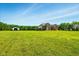 Large, verdant lawn surrounding this two-story home provides ample outdoor space and privacy at 4450 W 300 N, Fairland, IN 46126