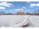 Brick home with driveway, snowy landscape, and detached garage at 4450 W 300 N, Fairland, IN 46126