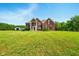 A beautiful brick house with a sprawling green lawn offers a picturesque suburban living experience at 4450 W 300 N, Fairland, IN 46126