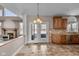 Kitchen with access to backyard, island, and wooden cabinetry at 4450 W 300 N, Fairland, IN 46126
