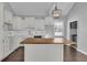 Modern kitchen with white shaker cabinets, quartz countertops and a large island at 4450 W 300 N, Fairland, IN 46126