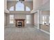 Large living room with fireplace, high ceilings, and lots of windows at 4450 W 300 N, Fairland, IN 46126