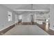 Open living room with high ceilings, hardwood floors, and large windows at 4450 W 300 N, Fairland, IN 46126