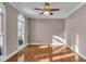 Bright office features hardwood floors, large window, and ceiling fan at 4450 W 300 N, Fairland, IN 46126