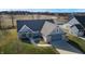 Single-story home with gray garage and a manicured lawn at 4667 W Meadows Ln, New Palestine, IN 46163