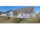 Backyard with patio, privacy fence, and grassy area at 4667 W Meadows Ln, New Palestine, IN 46163