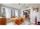 Dining area with wooden table and kitchen view at 4667 W Meadows Ln, New Palestine, IN 46163