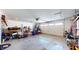Spacious garage with overhead door and ample storage space at 4667 W Meadows Ln, New Palestine, IN 46163