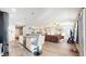 Open concept kitchen with island, stainless steel appliances, and hardwood floors at 4667 W Meadows Ln, New Palestine, IN 46163