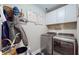 Convenient laundry room complete with washer, dryer, and ample storage at 4667 W Meadows Ln, New Palestine, IN 46163