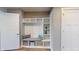 Laundry room with built-in shelving, a washer and dryer, and stylish wall decor at 4667 W Meadows Ln, New Palestine, IN 46163