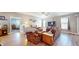 Living room with floral sofas, wood flooring and a TV at 4667 W Meadows Ln, New Palestine, IN 46163