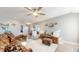 Bright living room with comfy seating, large windows, and hardwood floors at 4667 W Meadows Ln, New Palestine, IN 46163