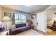 Cozy office space with a brown couch, built-in shelving, and a view of the backyard at 4667 W Meadows Ln, New Palestine, IN 46163