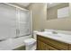 Clean bathroom with a shower/tub combo, toilet and wood vanity at 5201 N White Ln, Lawrence, IN 46226