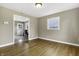 Bright dining room with hardwood floors and view into kitchen at 5201 N White Ln, Lawrence, IN 46226