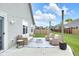 Cozy back patio featuring wicker furniture and outdoor lighting for a relaxing and inviting space at 5670 Terracotta Trce, McCordsville, IN 46055