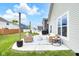 Inviting back patio with comfortable seating, providing an ideal spot for outdoor gatherings and relaxation at 5670 Terracotta Trce, McCordsville, IN 46055