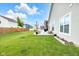 Spacious backyard with a well-maintained lawn and a charming patio area perfect for outdoor living at 5670 Terracotta Trce, McCordsville, IN 46055