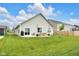 Expansive backyard featuring a lush green lawn and a cozy patio ideal for relaxation and entertainment at 5670 Terracotta Trce, McCordsville, IN 46055