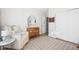Bedroom featuring rocking chair and dresser with decorative wall trim at 5670 Terracotta Trce, McCordsville, IN 46055