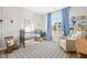 Bedroom with a crib, rocking chair, bookshelf and large windows for natural light at 5670 Terracotta Trce, McCordsville, IN 46055