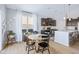 Open-concept kitchen and dining area with modern appliances and plenty of natural light at 5670 Terracotta Trce, McCordsville, IN 46055