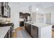 A modern kitchen featuring an island, stainless steel appliances, and ample counter space at 5670 Terracotta Trce, McCordsville, IN 46055