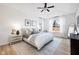 A bright, spacious main bedroom featuring a ceiling fan and natural light from the large windows at 5670 Terracotta Trce, McCordsville, IN 46055
