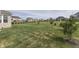 Landscaped backyard with a large grassy area at 5739 Bentbrook Dr, Bargersville, IN 46106