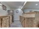 Basement bar with wooden cabinets and a stainless steel refrigerator at 5739 Bentbrook Dr, Bargersville, IN 46106