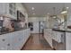 Modern kitchen with white cabinets, granite countertops, and stainless steel appliances at 5739 Bentbrook Dr, Bargersville, IN 46106