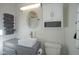 Simple bathroom with white beadboard, gray vanity, and updated fixtures at 6225 Hythe Rd, Indianapolis, IN 46220