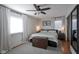 Main bedroom with wood flooring, ceiling fan, and a dresser at 6225 Hythe Rd, Indianapolis, IN 46220