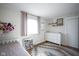 Cozy bedroom with white dresser and pink curtains at 6225 Hythe Rd, Indianapolis, IN 46220